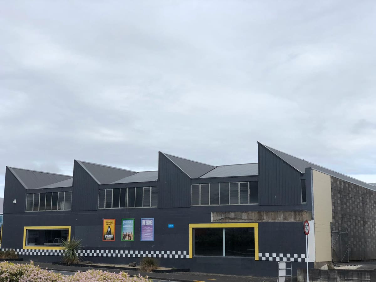 The commercial building after asbestos removal and a new long-run roof