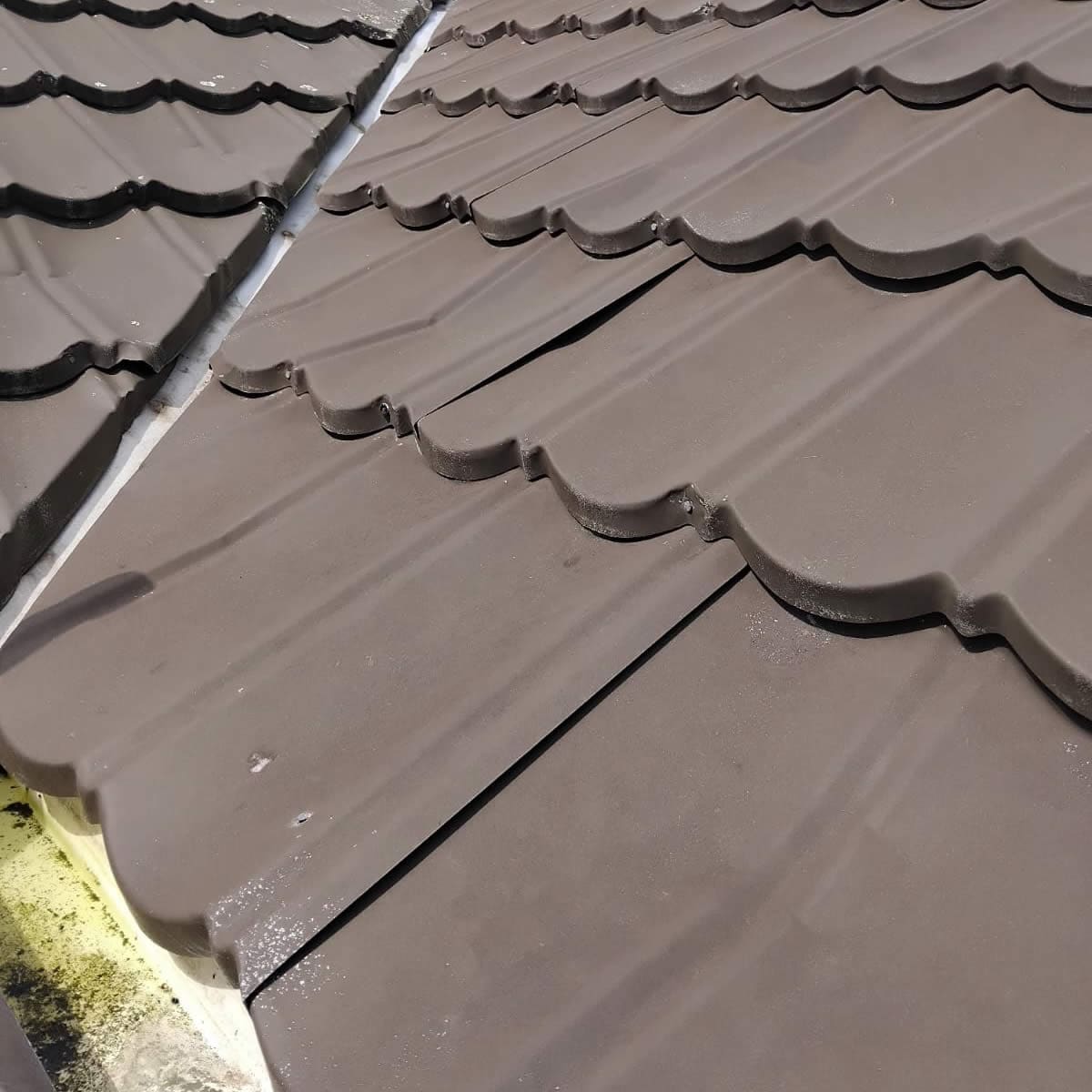 Dented Decramastic tiles before repair