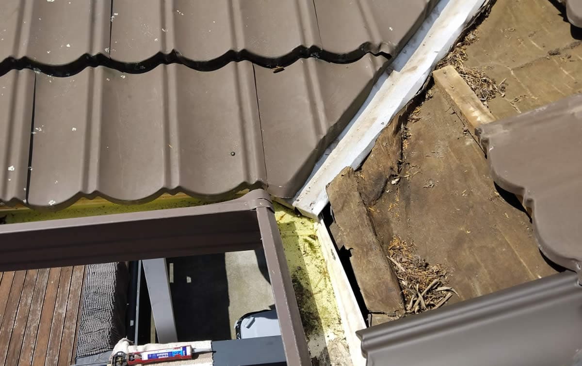 Damaged Decramastic tiles removed
