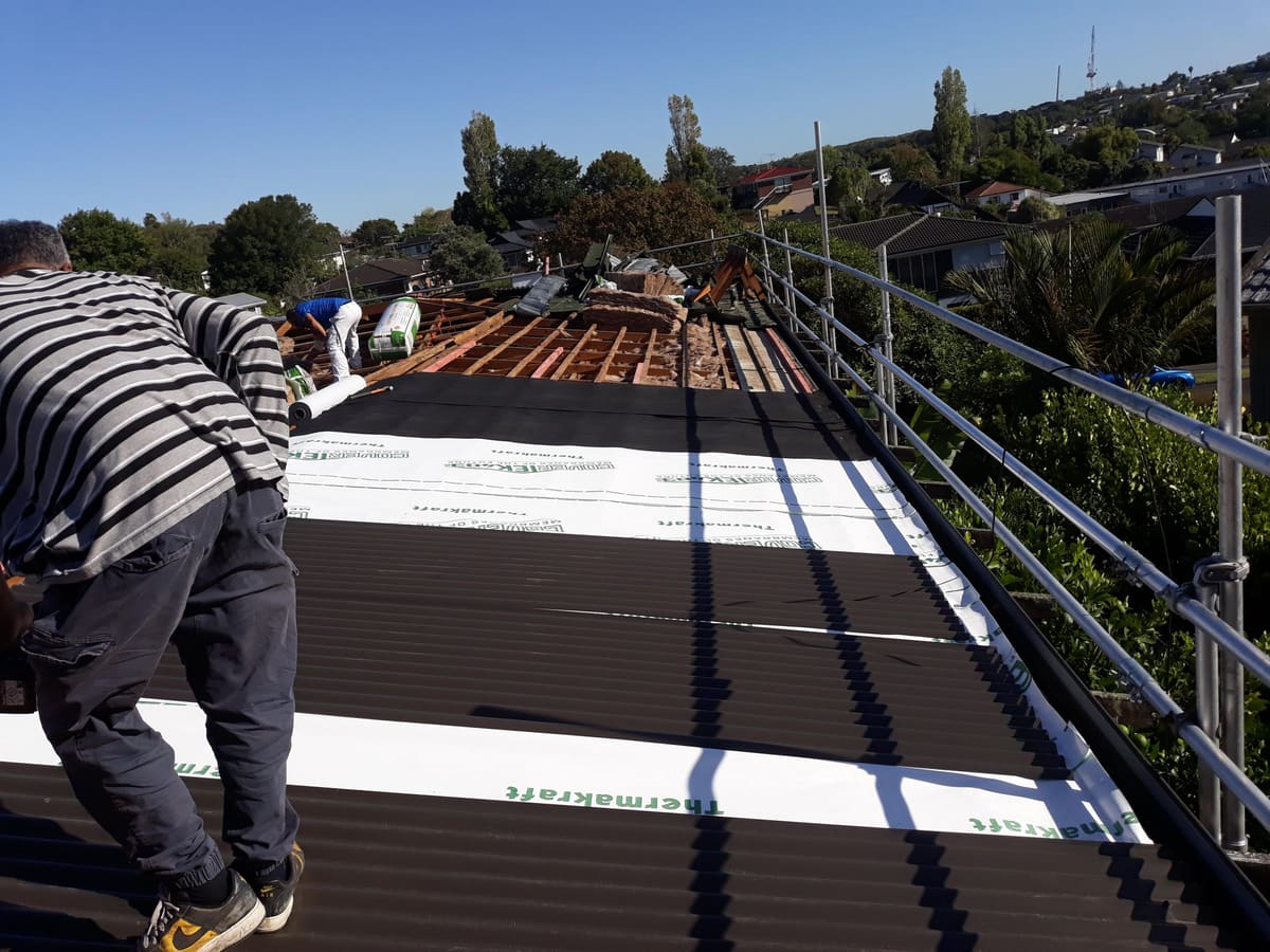 New long-run roofing being installed