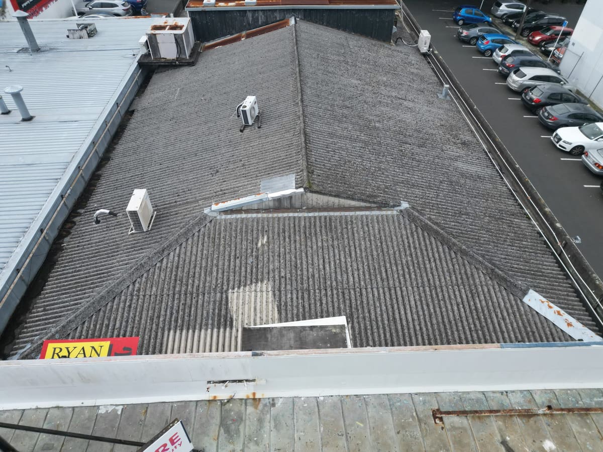 Aerial view of a large asbestos cement roof on an Auckland commercial building